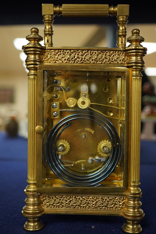 An early 20th century champleve enamel repeating carriage clock with subsidiary dial, with key, 19cm high